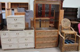A painted wicker chest of drawers together with a matching bedside cabinet, a wicker bookshelf,