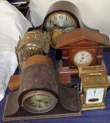 A mahogany Napoleon hat mantle clock together with other clocks