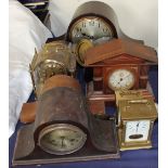 A mahogany Napoleon hat mantle clock together with other clocks