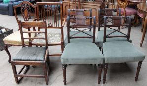 An Edwardian mahogany elbow chair together with an Edwardian shield back chair and a set of four