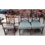An Edwardian mahogany elbow chair together with an Edwardian shield back chair and a set of four