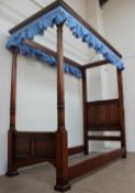 A 20th century oak four poster single bed, the canopy with a moulded cornice,
