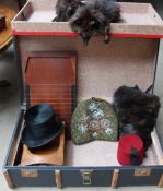 A wooden bound trunk, together with a fur stole, fur muff, a beadwork tea cosy, a top hat,