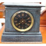 A black slate mantle clock,