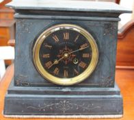 A black slate mantle clock,