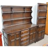 An Ercol kitchen dresser, the rack with two shelves,