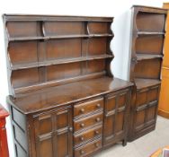 An Ercol kitchen dresser, the rack with two shelves,