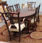 A reproduction mahogany extending dining table together with six chairs and a coffee table