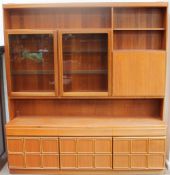 A McIntosh teak wall unit, with glazed cupboard doors, drinks cupboard, drawers,