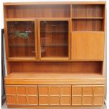 A McIntosh teak wall unit, with glazed cupboard doors, drinks cupboard, drawers,