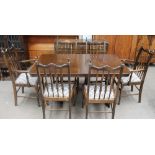 A 20th century oak dining suite comprising an extending dining table,