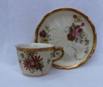 A Royal Worcester porcelain tea cup and saucer,