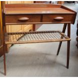 A Danish teak side table with a rectangular top and three-quarter gallery with two drawer above a