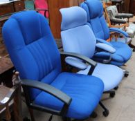 Three upholstered office chairs together with a rocking chair