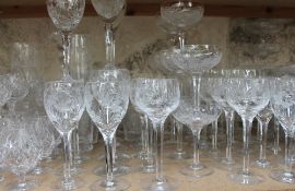 An extensive suite of Stuart crystal glasswares including wine glasses champagne glasses bon bon