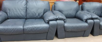 A blue leather upholstered three-piece suite