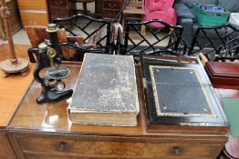 A J Swift black lacquered monocular microscope together with a Victorian Burr Walnut lap top desk