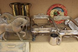 A pair of trench art twin handled vases together with a pair of horse door stops stamped 'Llanelly