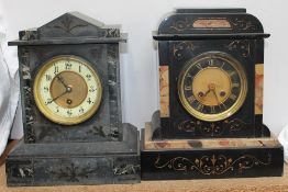 A black slate mantle clock of architectural form the dial with Arabic numerals together with