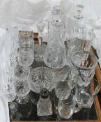 A collection of glass decanters, jugs,