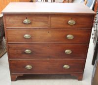 A George III mahogany chest with a rectangular top,