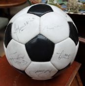 A Football inscribed "To Tim From The England Squad" including signatures from Trevor Brooking,