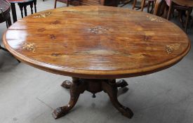 A Victorian walnut inlaid oval topped supper table