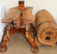 A William Grant & Sons whisky barrel together with the base of a camel stool