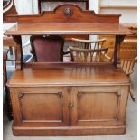 A 19th century mahogany buffet with a shaped back, rectangular rounded top shelf,