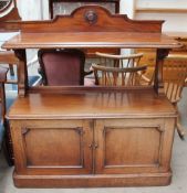 A 19th century mahogany buffet with a shaped back, rectangular rounded top shelf,