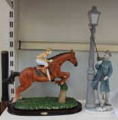A Lladro figure of a lamp lighter together with a resin figure of a jump jockey