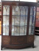 A 20th century mahogany display cabinet on bracket feet