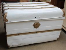 A cream and gold painted trunk