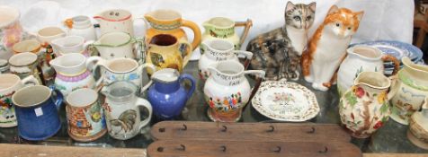 A collection of pottery jugs including Widdicombe fair, other decorative character jugs,