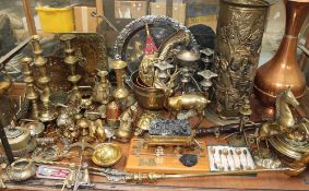 A large quantity of brass and copper including candlesticks, umbrella stand,
