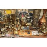 A large quantity of brass and copper including candlesticks, umbrella stand,