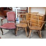 An Ercol light teak rocking chair together with a pair of teak dining chairs an upholstered elbow