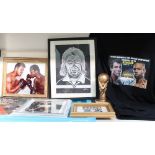 A Joe Calzaghe vs Jones signed t-shirt together with boxing photographs, RIVA signed statue,