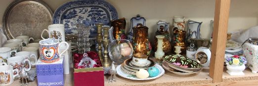 A blue and white willow pattern meat plate together with copper lustre jugs, other jugs,