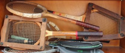 A Wilson Jack Kramer tennis racket together with other tennis and badminton rackets