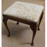 A 20th century upholstered walnut dressing table stool