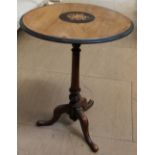 A late Victorian inlaid wine table with a circular top on a tapering column and three legs