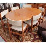 A teak extending dining table and six chairs