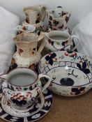 A collection of Gaudy Welsh pottery jugs and bowls