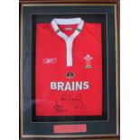 A framed and glazed Welsh Rugby Union jersey signed by Tom Shanklin,