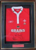 A framed and glazed Welsh Rugby Union jersey signed by Tom Shanklin,