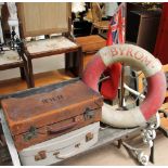 A brown leather suitcase together with another suitcase,