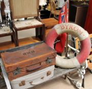 A brown leather suitcase together with another suitcase,