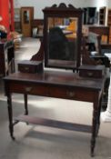 A late Victorian mahogany dressing table with a rectangular mirror,