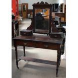 A late Victorian mahogany dressing table with a rectangular mirror,